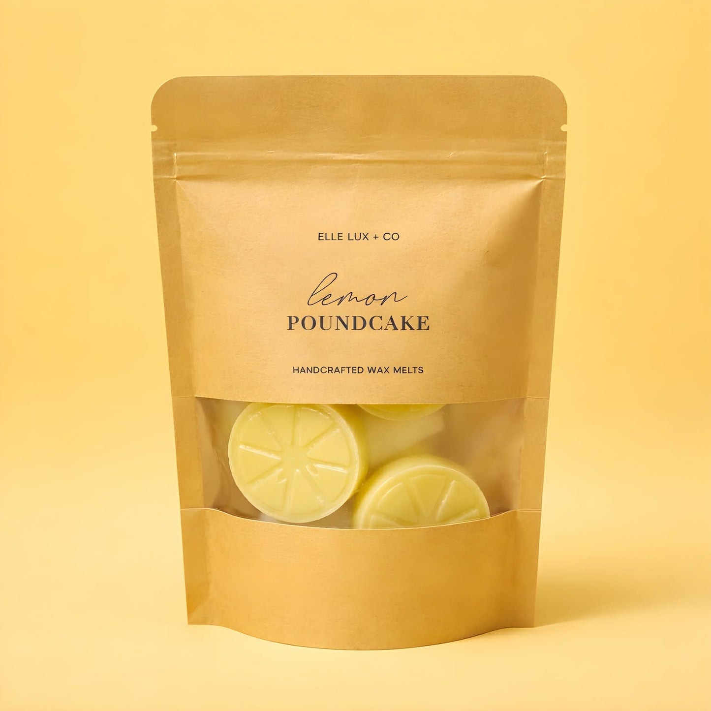Pack of lemon poundcake scented wax melts by Elle Lux & Co on a yellow background