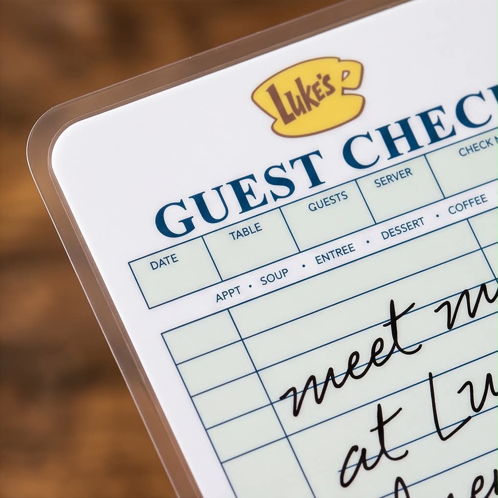 Close-up of a Gilmore Girls inspired Luke's Diner guest check bookmark featuring a vintage restaurant ticket design with rounded laminated corners.
