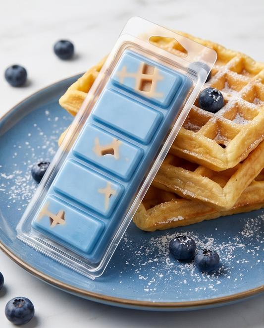 Blueberry waffle wax melts on a plate of waffles with blueberries