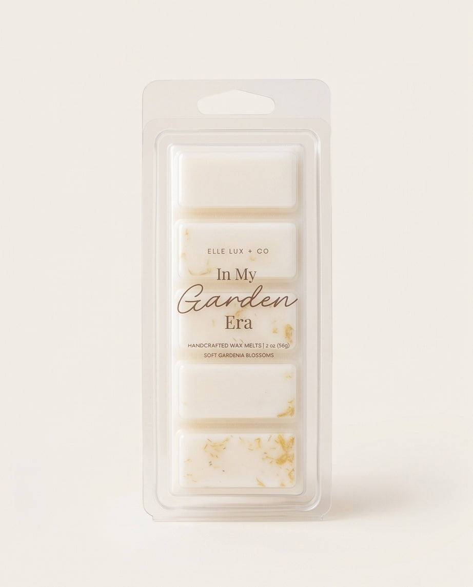 Packaged wax melts with 'In My Garden Era' text on a light background