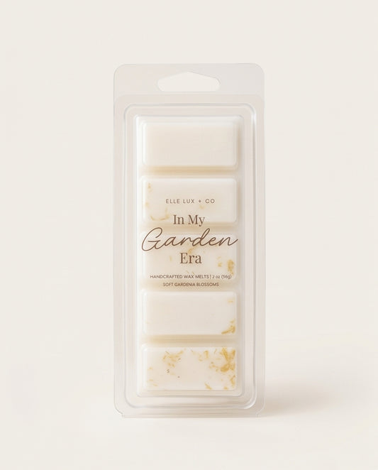 Packaged wax melts with 'In My Garden Era' text on a light background